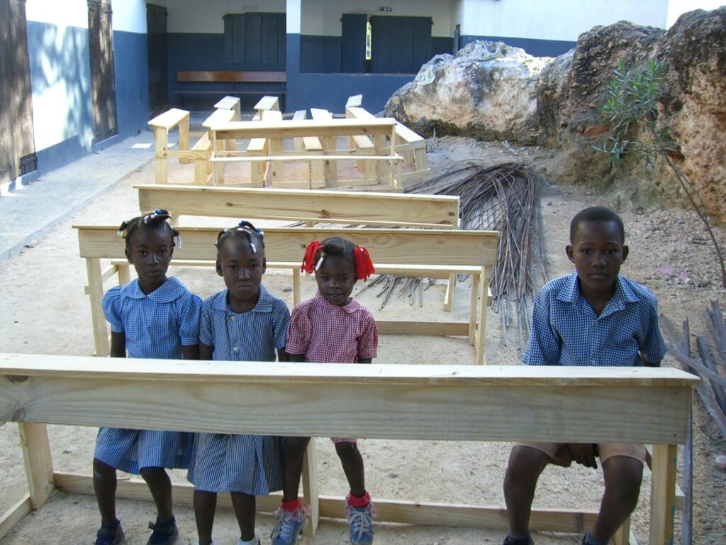 Young students trying out the new desks.